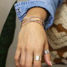 Load image into Gallery viewer, Silver Plated Hammered Triple Wave Strand Bangle
